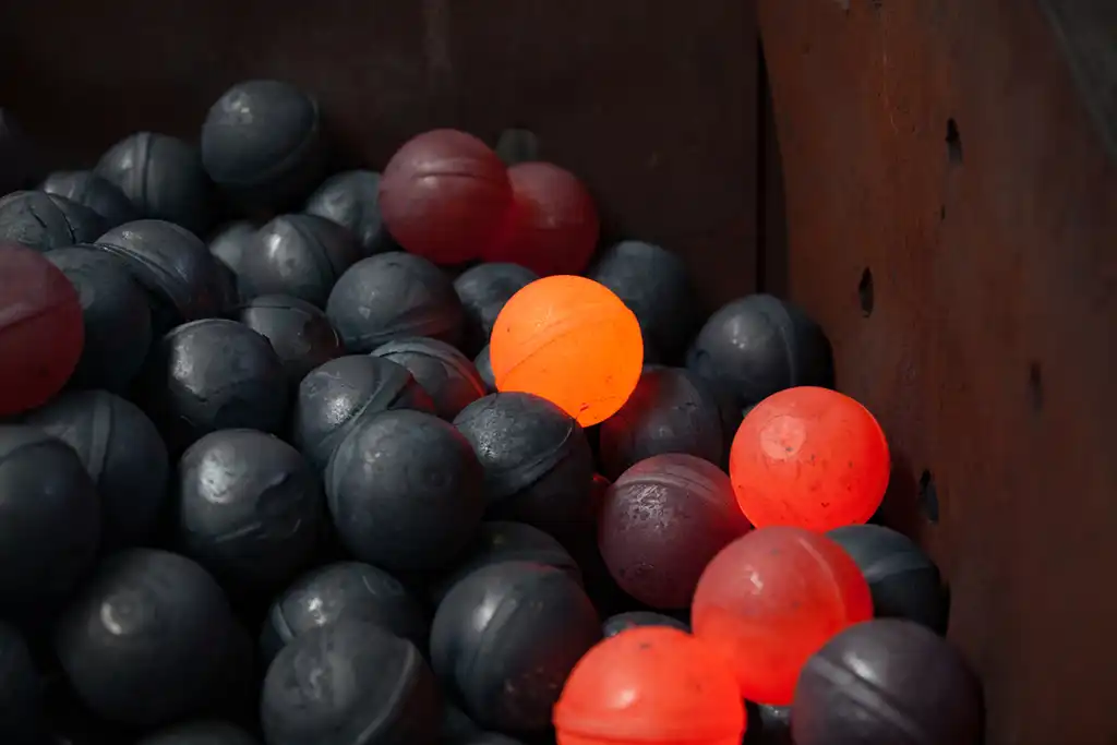 The preliminary shaping process for the creation of ball bearings involves the initial forming of blanks, which serve as the starting point for crafting the spherical balls.